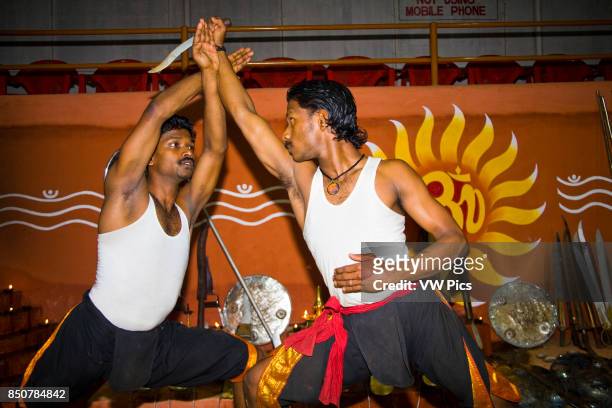 Kalarippayattu martial arts performers fighting, Kerala Kalari Centre, Kumily, Kerala, India.