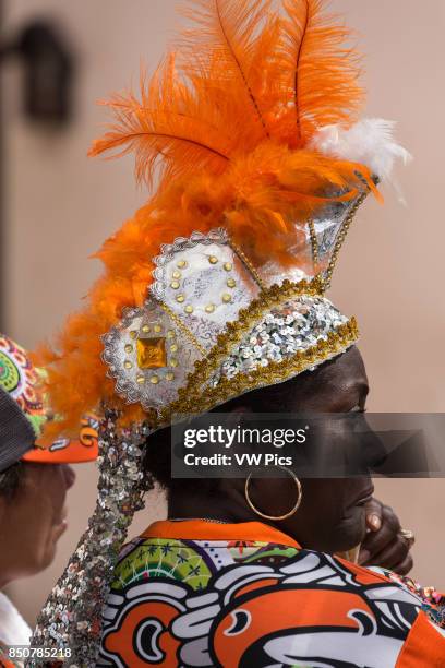 Woman wears a feathered headdress to watch the Carnival in La VegA The first documented Carnival celebration in what is now the Dominican Republic...