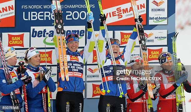 Lina Andersson and Anna Olsson of Sweden, Aino Kaisa Saarinen and Virpi Kuitunen of Finland and Arianna Follis and Marianna Longa of Italy celebrate...