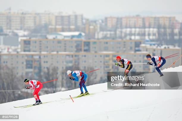 George Grey of Canada, Jean Marc Gaillard of France, Tobias Angerer of Germany and Andrew Musgrave of Great Britain compete during the Men's Cross...