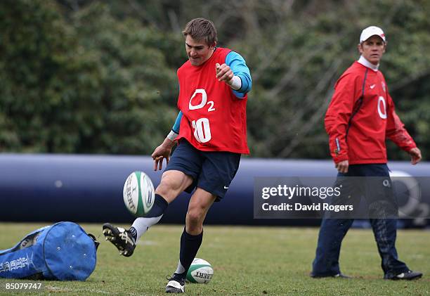 Toby Flood, the England standoff watched by Brian Smith, the England attack coach during the England training session held at the Pennyhill Park...