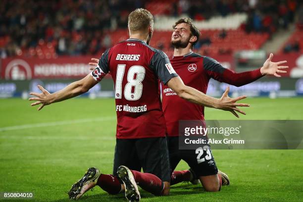 Hanno Behrens of Nuernberg celebrates his team's second goal with team mate Tim Leibold during the Second Bundesliga match between 1. FC Nuernberg...