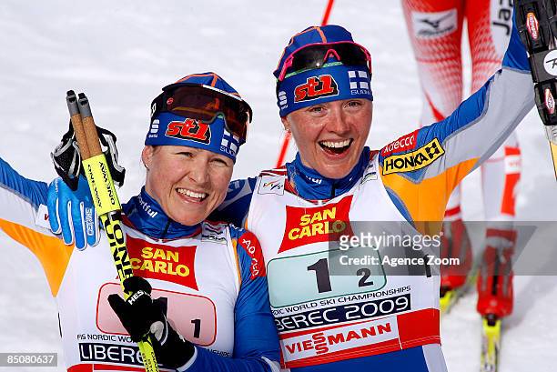 Aino-Kaisa Saarinen of Finland and Virpi Kuitunen of Finland take 1st place in the FIS Nordic World Ski Championships Cross Country Ladies Free Team...