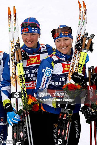Virpi Kuitunen of Finland and Aino-Kaisa Saarinen of Finland take 1st place in the FIS Nordic World Ski Championships Cross Country Ladies Free Team...