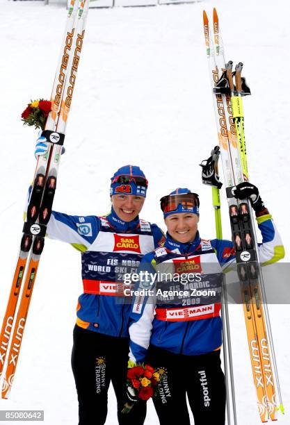 Virpi Kuitunen of Finland and Aino-Kaisa Saarinen of Finland take 1st place in the FIS Nordic World Ski Championships Cross Country Ladies Free Team...