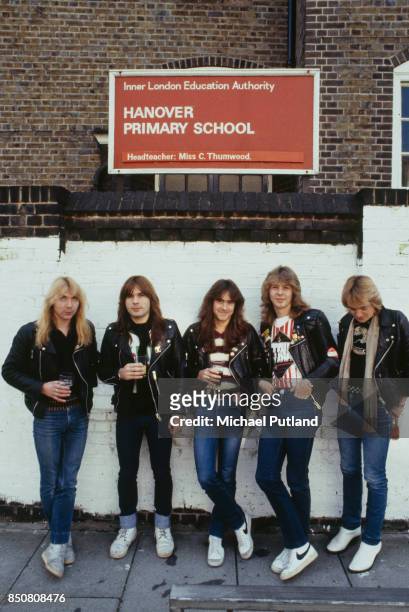 English heavy metal group Iron Maiden outside Hanover Primary School in Islington, London, 1982. Left to right: guitarist Dave Murray, singer Bruce...