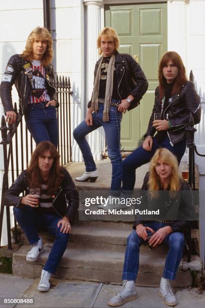 English heavy metal group Iron Maiden in Islington, London, 1982. Back row, left to right: drummer Clive Burr, guitarist Adrian Smith, and singer...