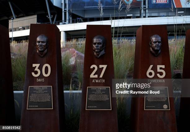 Brian Hanlon's busts of former Denver Broncos players Terrell Davis, Steve Atwater and Gary Zimmerman sits in 'Ring of Fame Plaza' outside Sports...