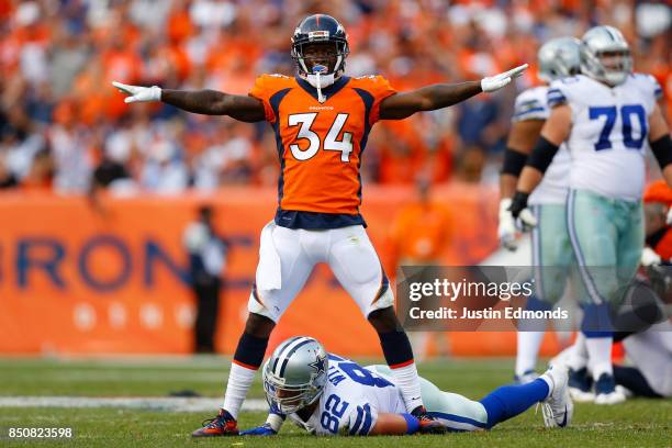 Defensive back Will Parks of the Denver Broncos reacts after defending a pass intended for Tight end Jason Witten of the Dallas Cowboys at Sports...