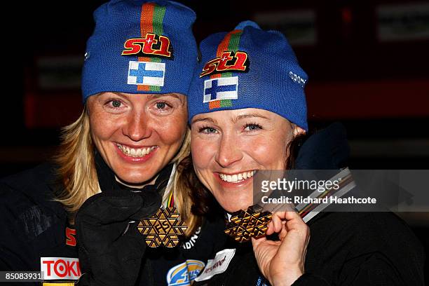 Virpi Kuitunen of Finland and Aino Kaisa Saarinen pose with the Gold medals won during the Ladies Cross Country Team Sprint Final at the FIS Nordic...