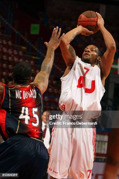 Mike Hall, #7 of AJ Milano competes with Will McDonald, #45 of TAU Ceramica during the Euroleague Basketball Last 16 Game 4 match between Armani...