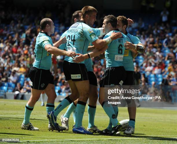 London Broncos' Michael Witt is congratulated after scoring a try during the Super League Magic Weekend at the Etihad Stadium, Manchester.