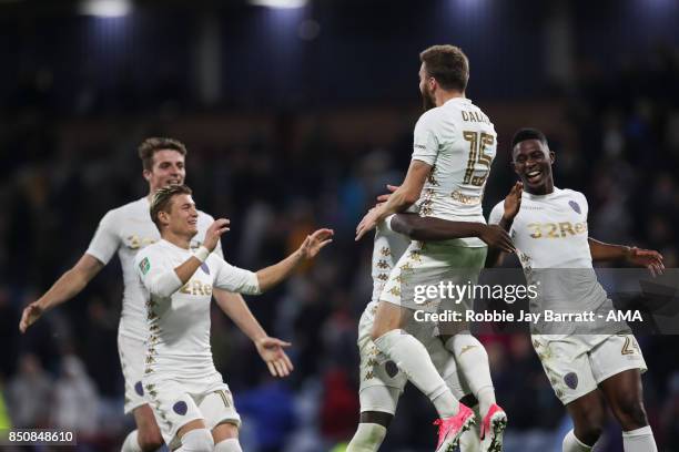 Stuart Dallas of Leeds United celebrates after scoring the winning penalty during the Carabao Cup Third Round match between Burnley and Leeds United...