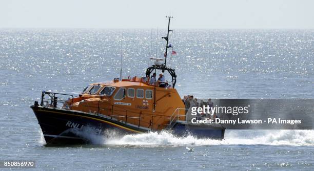 Royal National Lifeboat Institution volunteers John Connor and Kirstyn Howle as they marry each other on the Portpatrick lifeboat RNLB John Buchanan...