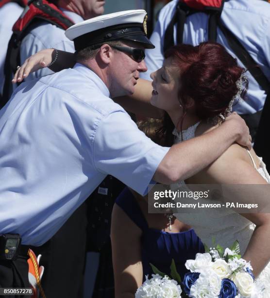 Royal National Lifeboat Institution volunteers John Connor and Kirstyn Howle as they marry each other on the Portpatrick lifeboat RNLB John Buchanan...