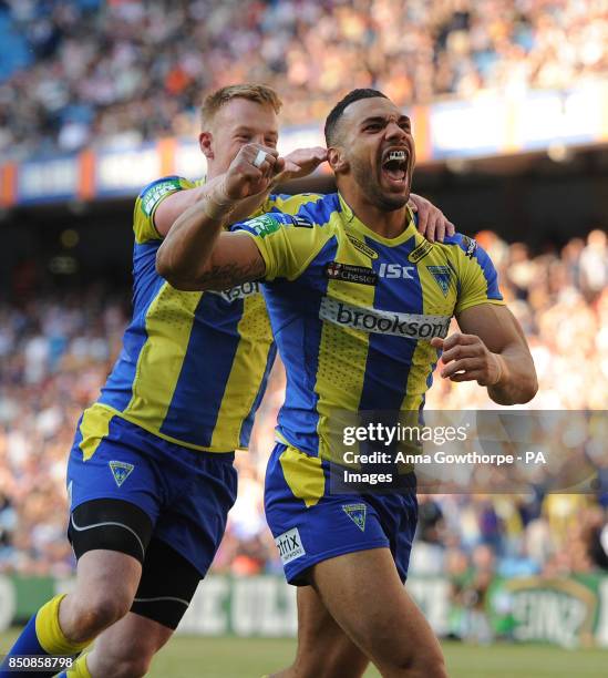 Warrington Wolves' Ryan Atkins celebrates with Chris Riley after scoring a try during the Super League Magic Weekend at the Etihad Stadium,...