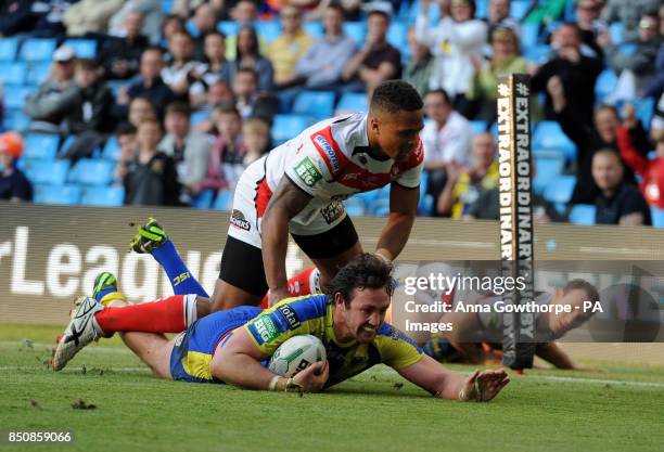 Warrington Wolves' Trent Waterhouse goes over to score a try during the Super League Magic Weekend at the Etihad Stadium, Manchester.