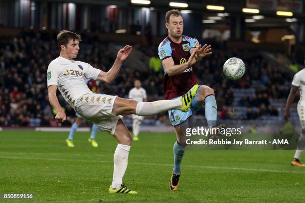 Conor Shaughnessy of Leeds United and Ashley Barnes of Burnley during the Carabao Cup Third Round match between Burnley and Leeds United at Turf Moor...