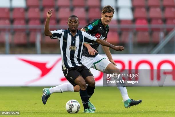 Guytho Mijland of USV Hercules, Etienne Reijnen of FC Groningen during the First round Dutch Cup match between USV Hercules and FC Groningen at the...