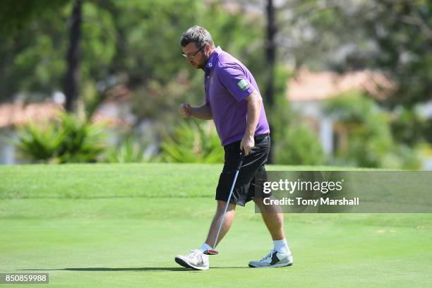 Martin Waghorn of Wolstanton Golf Club celebrates sinking his putt on the 18th green during The Lombard Trophy Final - Day One on September 21, 2017...