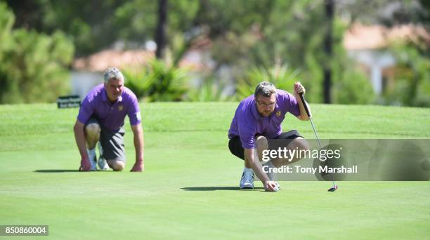 Nigel Onions of Wolstanton Golf Club and Martin Waghorn of Wolstanton Golf Club line up a putt on the 18th green during The Lombard Trophy Final -...