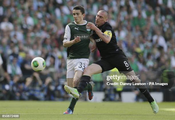 Celtic's Scott Brown and Hibernian's Alex Harris fight for the ball during the William Hill Scottish Cup Final at Hampden Park, Glasgow.