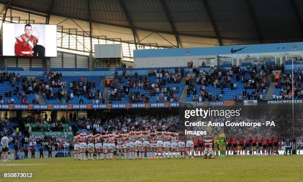 The Wigan Warriors and Leeds Rhinos teams observe a minute's silence in memory of murdered soldier Lee Rigby during the Super League Magic Weekend at...
