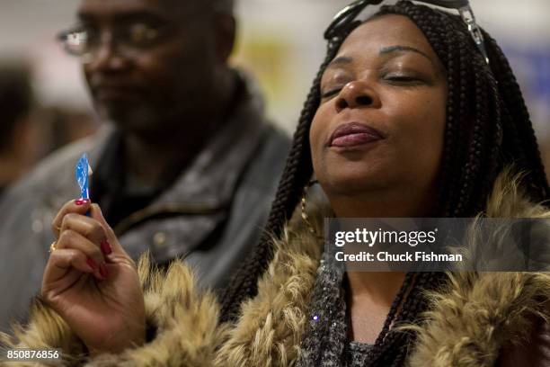 Portrait of a woman with her eyes closed as she samples a dessert during the Chocolate Expo at the Meadowlands Exposition Center, Secaucus, New...