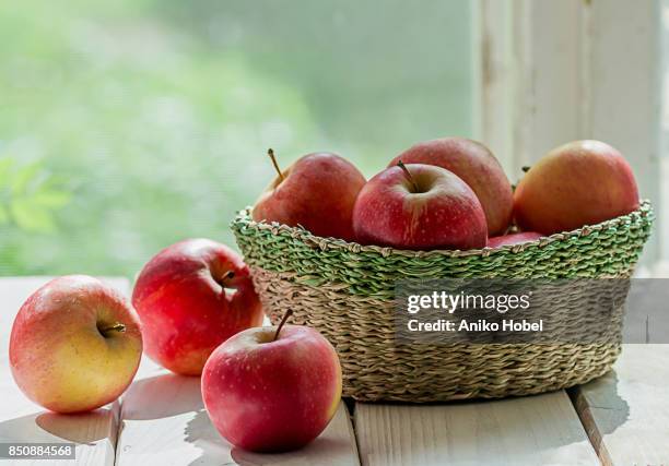apples on the window sill - juicy stock pictures, royalty-free photos & images