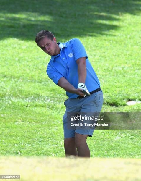 Jack Marsh of Ferndown Golf Club chips on to the 18th green during The Lombard Trophy Final - Day One on September 21, 2017 in Albufeira, Portugal.