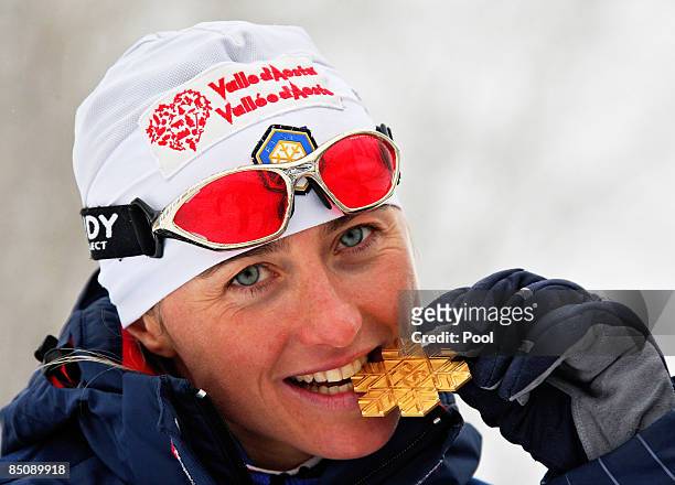 Arianna Follis of Italy poses with the Gold medal won during the Ladies Cross Country Sprint Final A at the FIS Nordic World Ski Championships 2009...