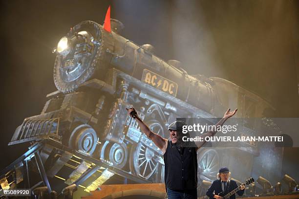 British singer Brian Johnson and guitarist Angus Young of the hard rock band AC/DC perform at the Palais Omnisport of Paris Bercy, on February 25 in...