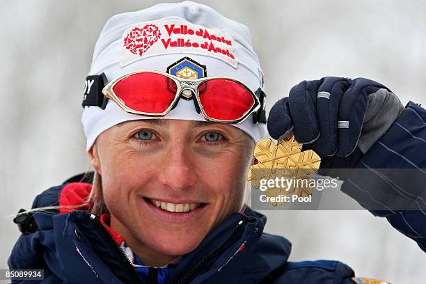 Arianna Follis of Italy poses with the Gold medal won during the Ladies Cross Country Sprint Final A at the FIS Nordic World Ski Championships 2009...