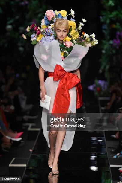 Supermodel Gigi Hadid walks the runway at the Moschino Spring Summer 2018 fashion show during Milan Fashion Week on September 21, 2017 in Milan,...