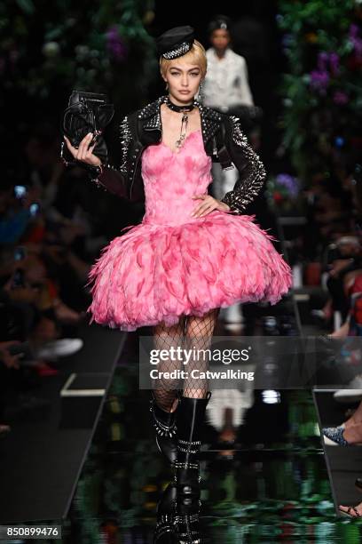 Supermodel Gigi Hadid walks the runway at the Moschino Spring Summer 2018 fashion show during Milan Fashion Week on September 21, 2017 in Milan,...