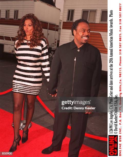 Los Angeles, CA. Pam Grier and date arrives at the 25th Annual American Music Awards rehearsal.