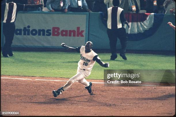Edgar Renteria of the Florida Marlins celebrates after winning the 1997 Major League Baseball World Series against the Cleveland Indians at Pro...