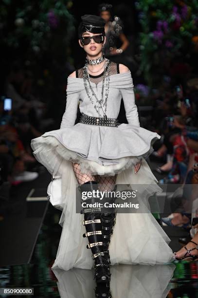 Model walks the runway at the Moschino Spring Summer 2018 fashion show during Milan Fashion Week on September 21, 2017 in Milan, Italy.