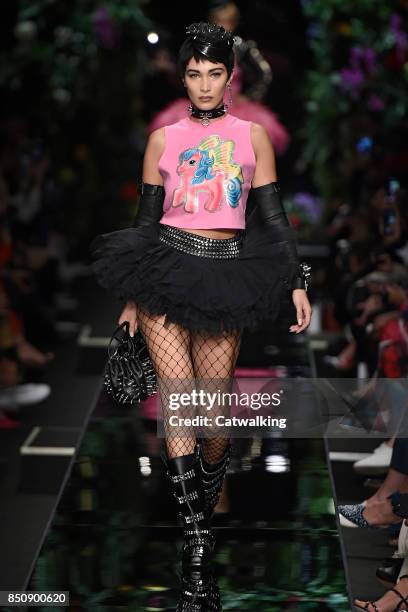 Model walks the runway at the Moschino Spring Summer 2018 fashion show during Milan Fashion Week on September 21, 2017 in Milan, Italy.