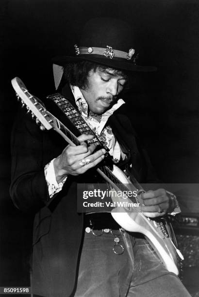 Photo of Jimi HENDRIX and JIMI HENDRIX EXPERIENCE; Jimi Hendrix performing on stage, playing white Fender Stratocaster guitar