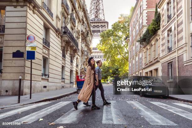 lovely couple spending some days in vacation to paris - paris france stock pictures, royalty-free photos & images
