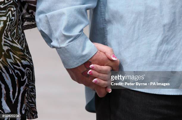Coral and Paul Jones, the parents of April Jones hold hands as they give a statement outside Mold Crown Court after Mark Bridger was given a whole...
