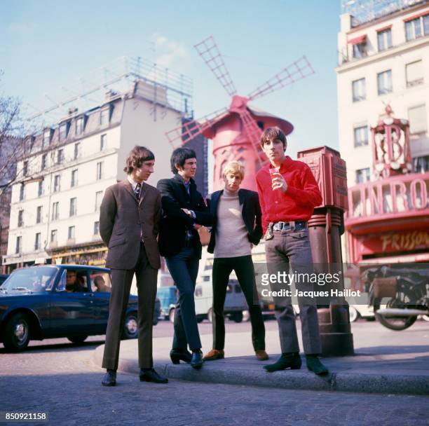 British rock band The Who, composed of lead singer Roger Daltrey, guitarist Pete Townsend, drummer Keith Moon, and bassist John Entwistle, stand in...