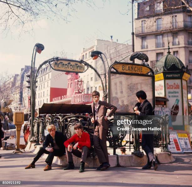 British rock band The Who, composed of lead singer Roger Daltrey, guitarist Pete Townsend, drummer Keith Moon, and bassist John Entwistle, stand in...