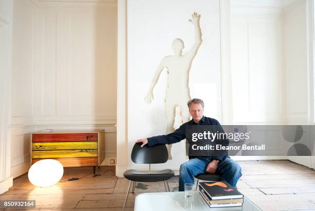 Ben Evans, Director of the London Design Festival. Photographed in his offices in London W1, UK. Anthony Gormley, Waste Man ; Jasper Morrison,...