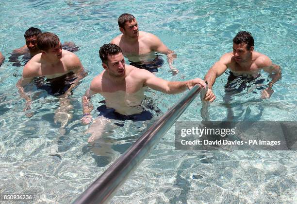 British and Irish Lions Alex Cuthbert, Owen Farrell, Dan Lydiate and Mike Phillips during a post match recovery session in the pool of the Grand...