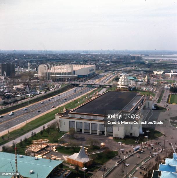 Panoramic aerial view facing northwest across the 1964 New York World's Fairgrounds toward LaGuardia Airport on Flushing Bay, in Corona, Queens, New...