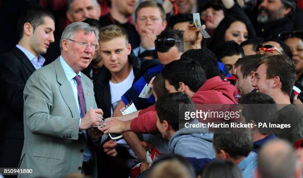 Sir Alex Ferguson signs autographs before the Legends Match at Old Trafford, Manchester.
