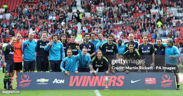 Real Madrid with the trophy after their 2-1 win against Manchester United during the Legends Match at Old Trafford, Manchester.