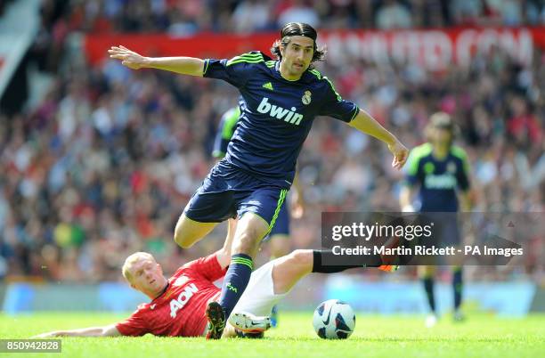 Real Madrid's Ruben De La Red skips a challenge from Manchester United's Paul Scholes during the Legends Match at Old Trafford, Manchester.